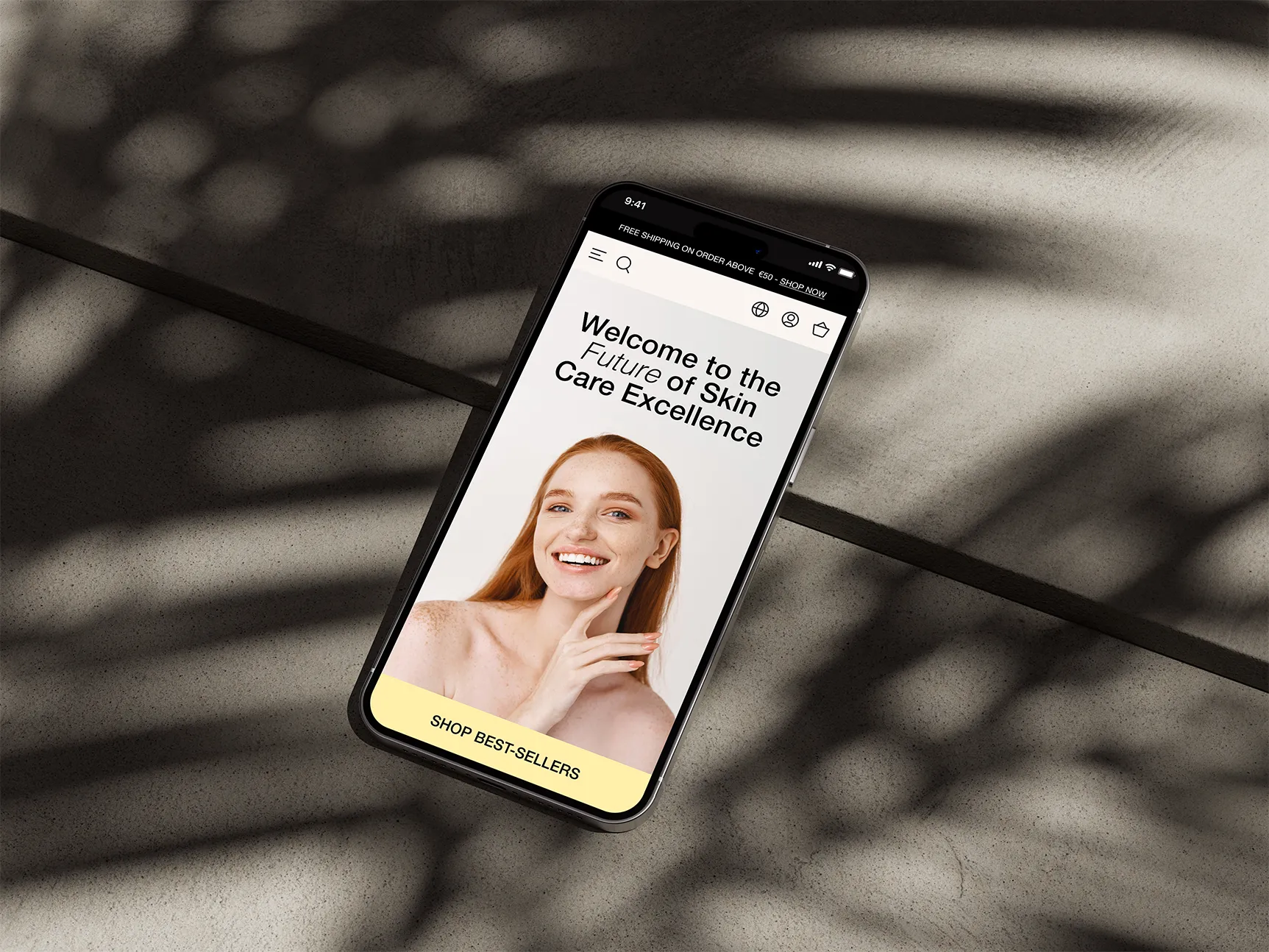 Iphone placed on a concrete sidewalk. Showcasing kata.design work - webflow template for beauty and skincare brands.